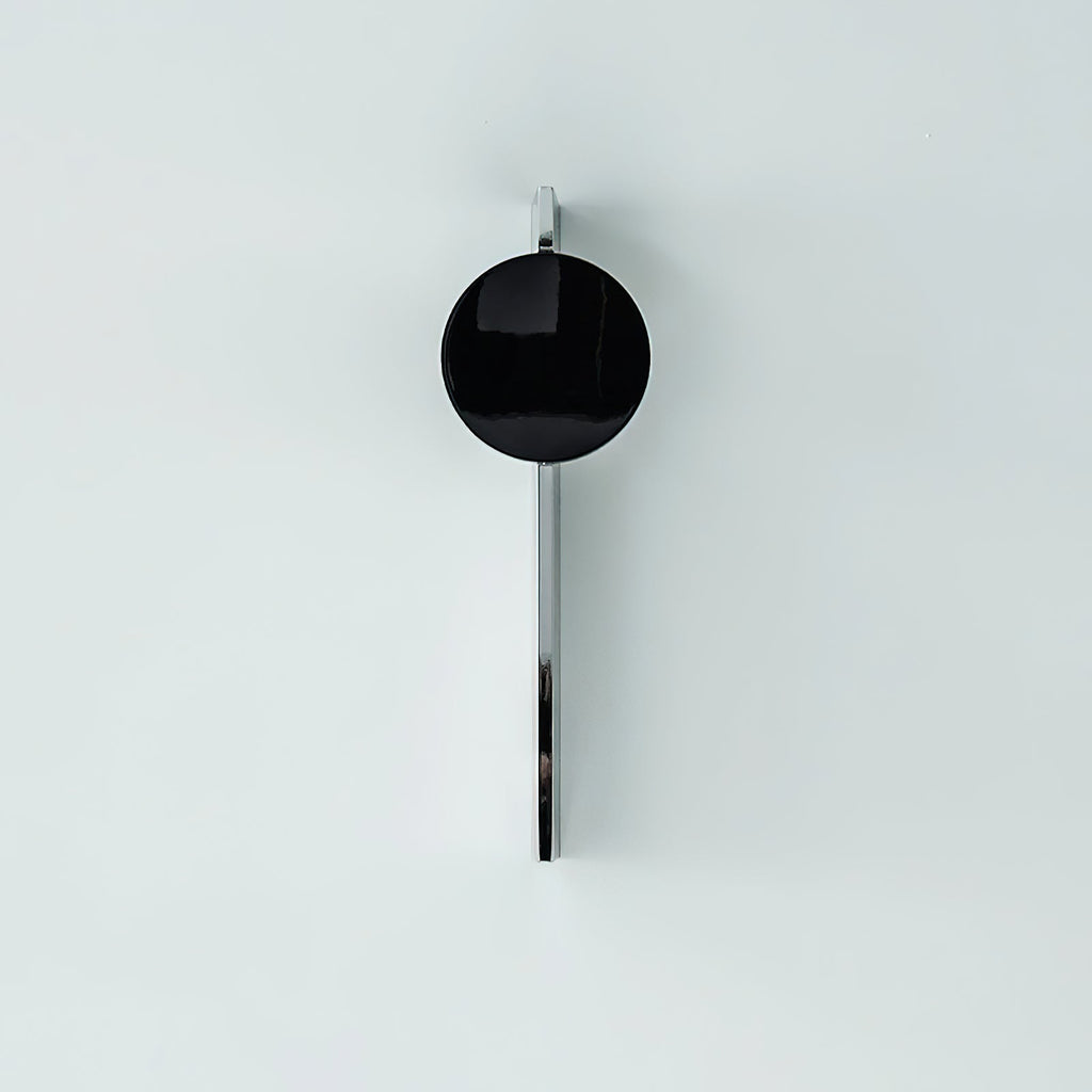Chrome light-and-shadow wall lamp with warm LED accent