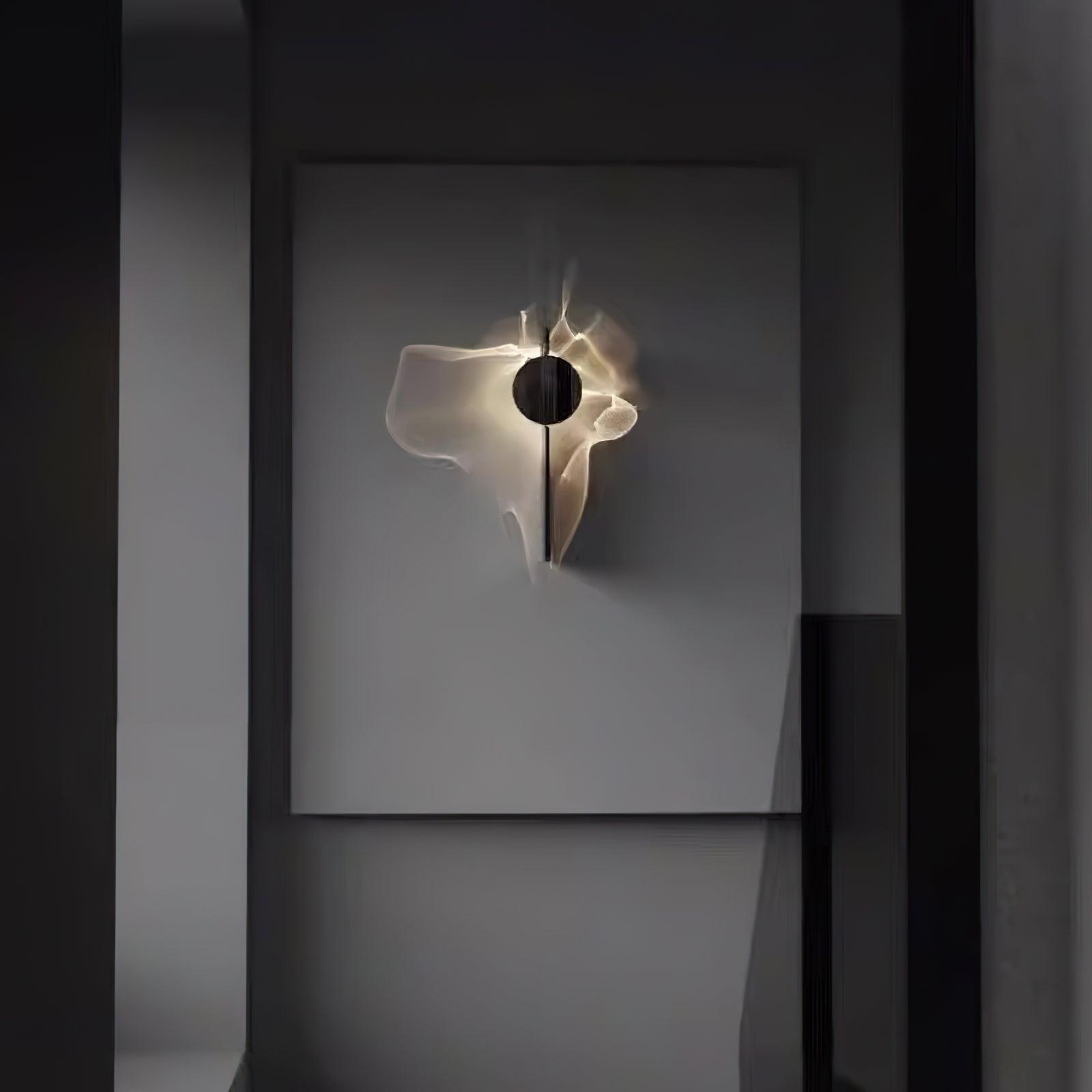 Chrome wall lamp with integrated LED glowing warmly