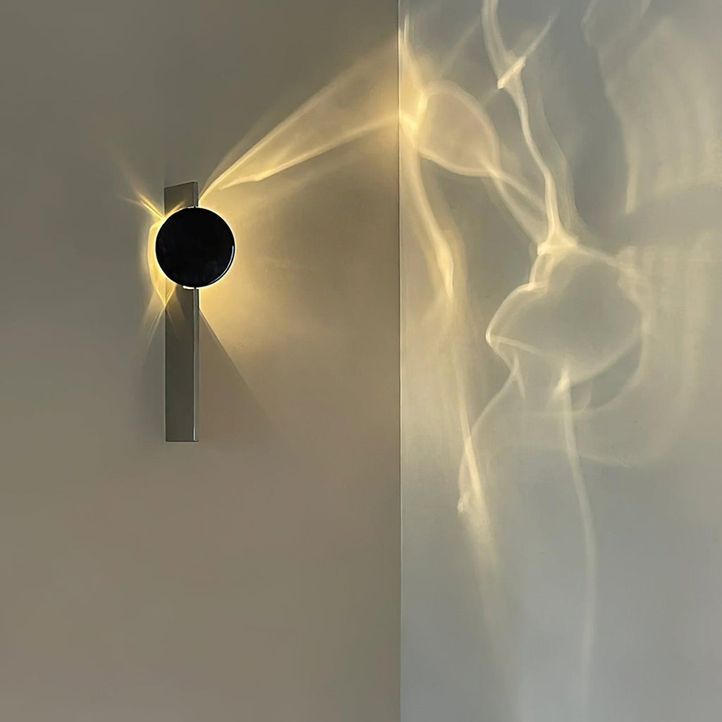 Chrome wall lamp with integrated LED on a neutral wall