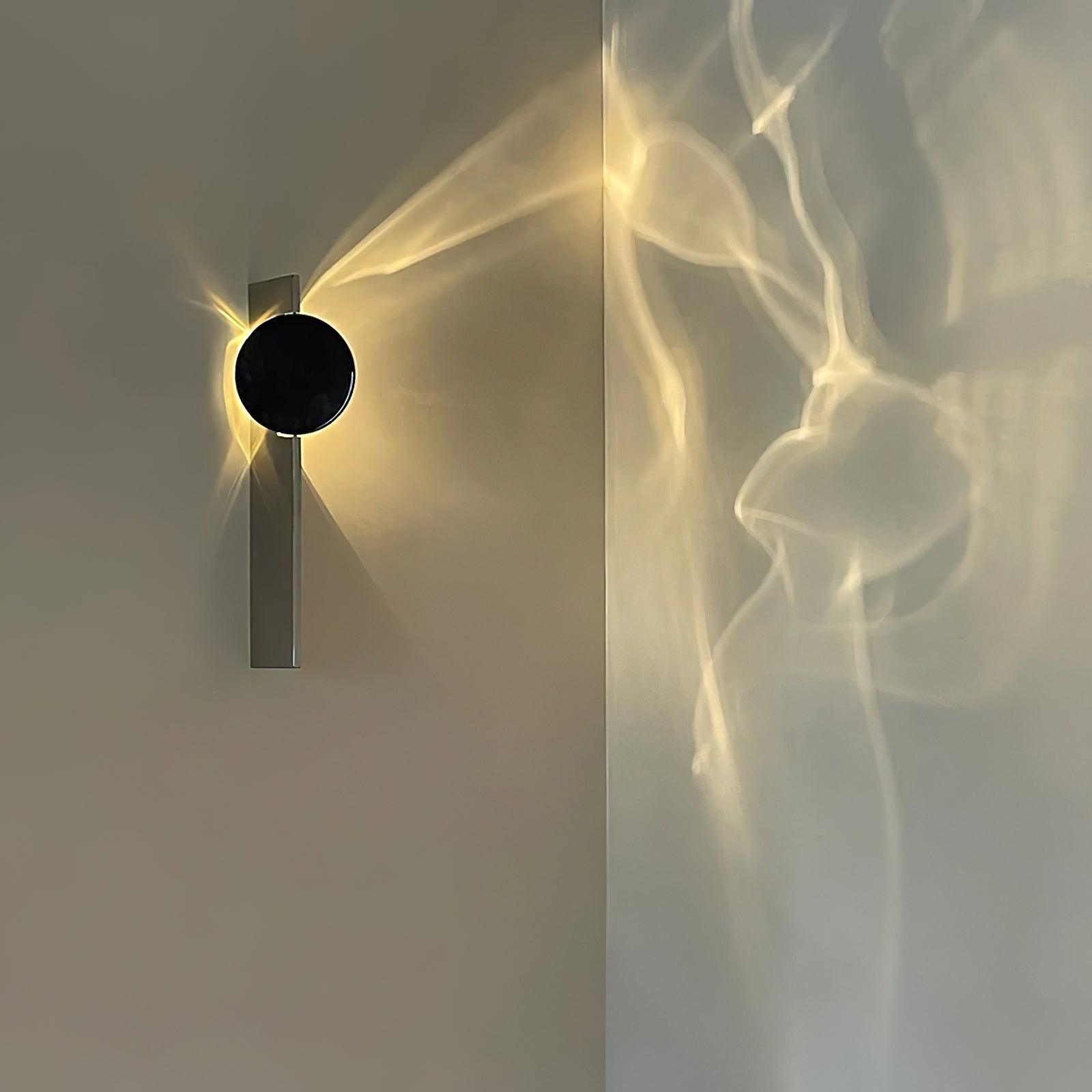 Chrome wall lamp with integrated LED on a neutral wall