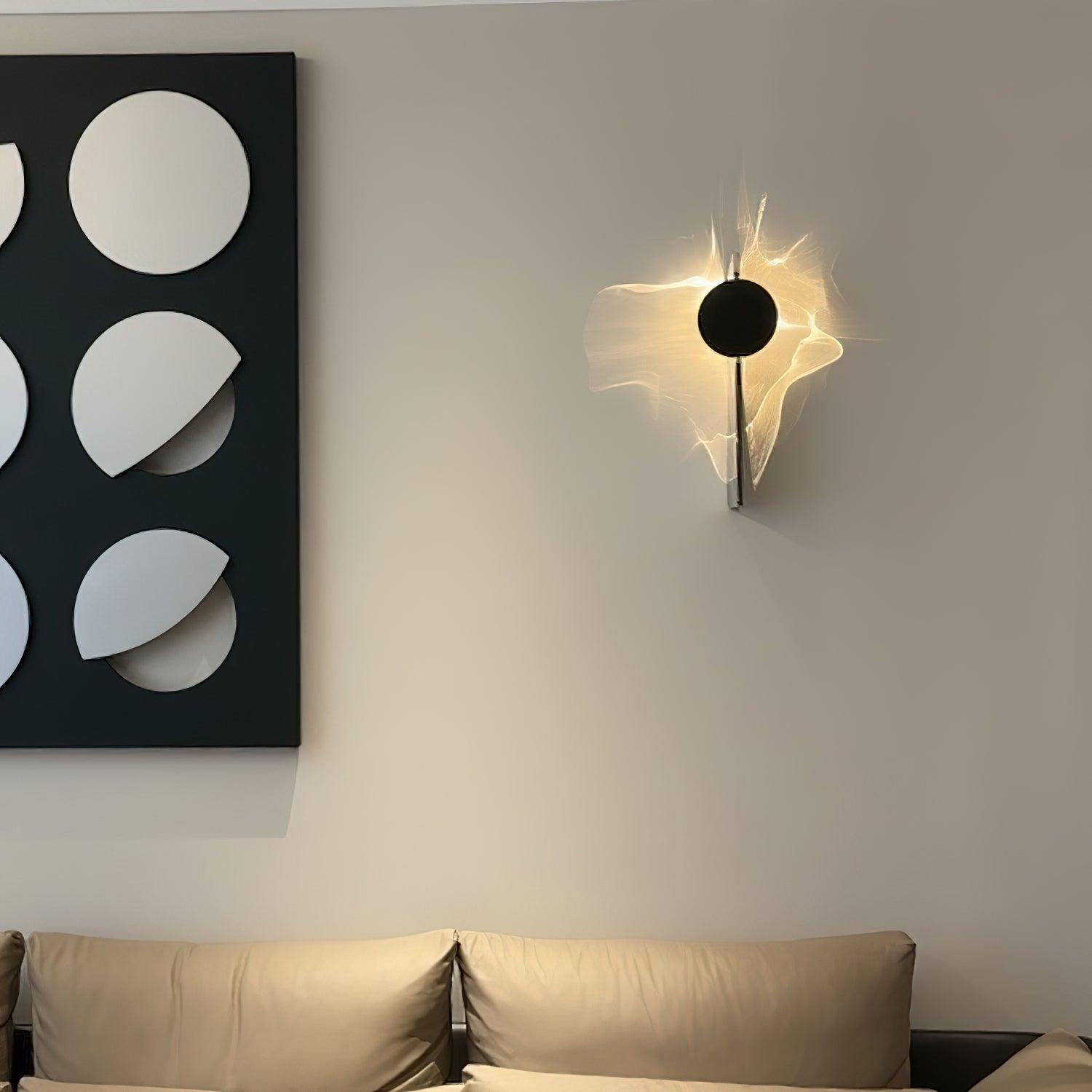 Sculptural chrome wall lamp casting moving shadow patterns