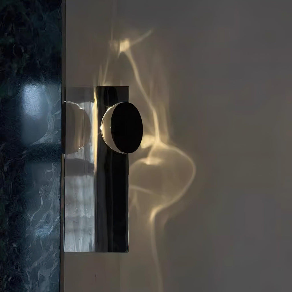 Polished chrome wall lamp with black shade and warm LED