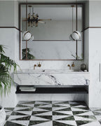 Before a mirror above a chequered marble floor, two pendants of this Clérachic fixture hang.