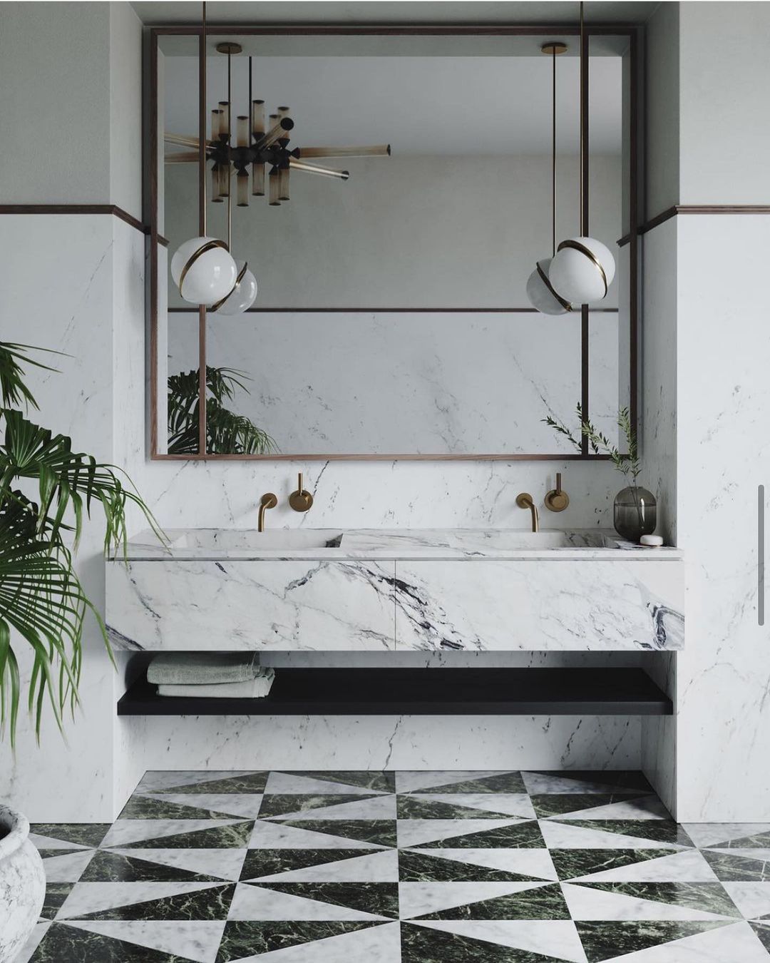 Before a mirror above a chequered marble floor, two pendants of this Clérachic fixture hang.