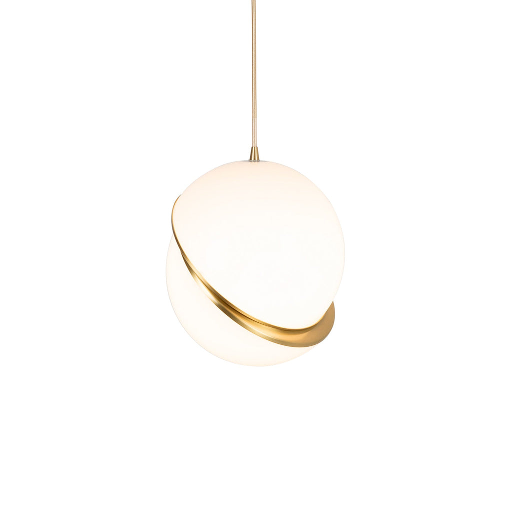 Far from the camera on a long brass cord, a single Clérachic pendant hangs against a plain grey backdrop.