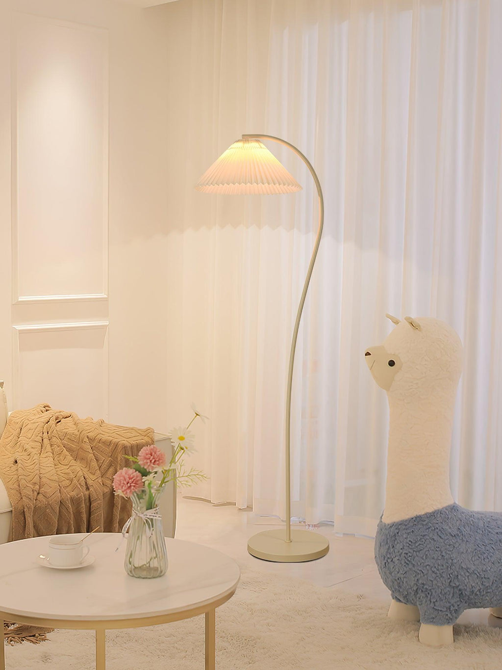 Pleated floor lamp shown full length in a neutral studio