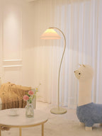 Pleated floor lamp shown full length in a neutral studio