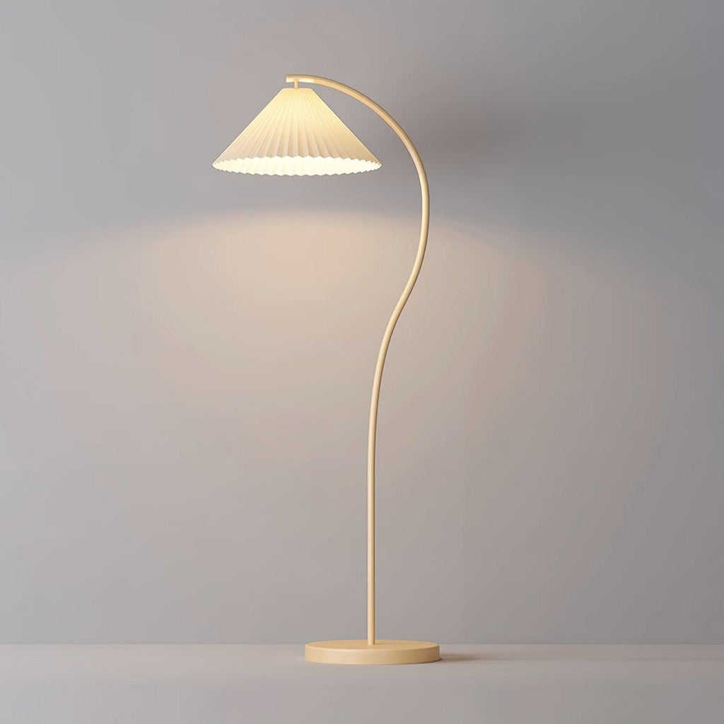 Pleated linen floor lamp lighting a cosy reading corner