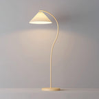 Pleated linen floor lamp lighting a cosy reading corner