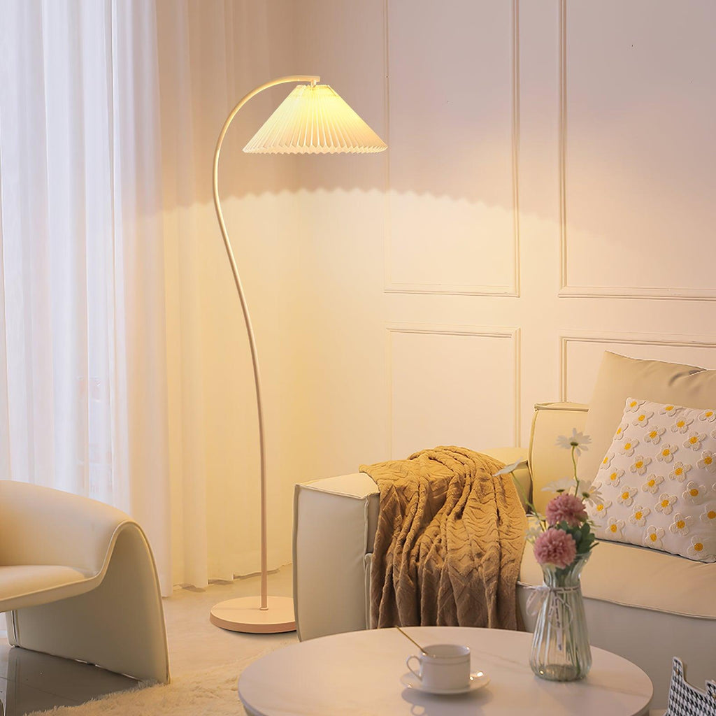 Pleated linen floor lamp beside furniture in a bright interior