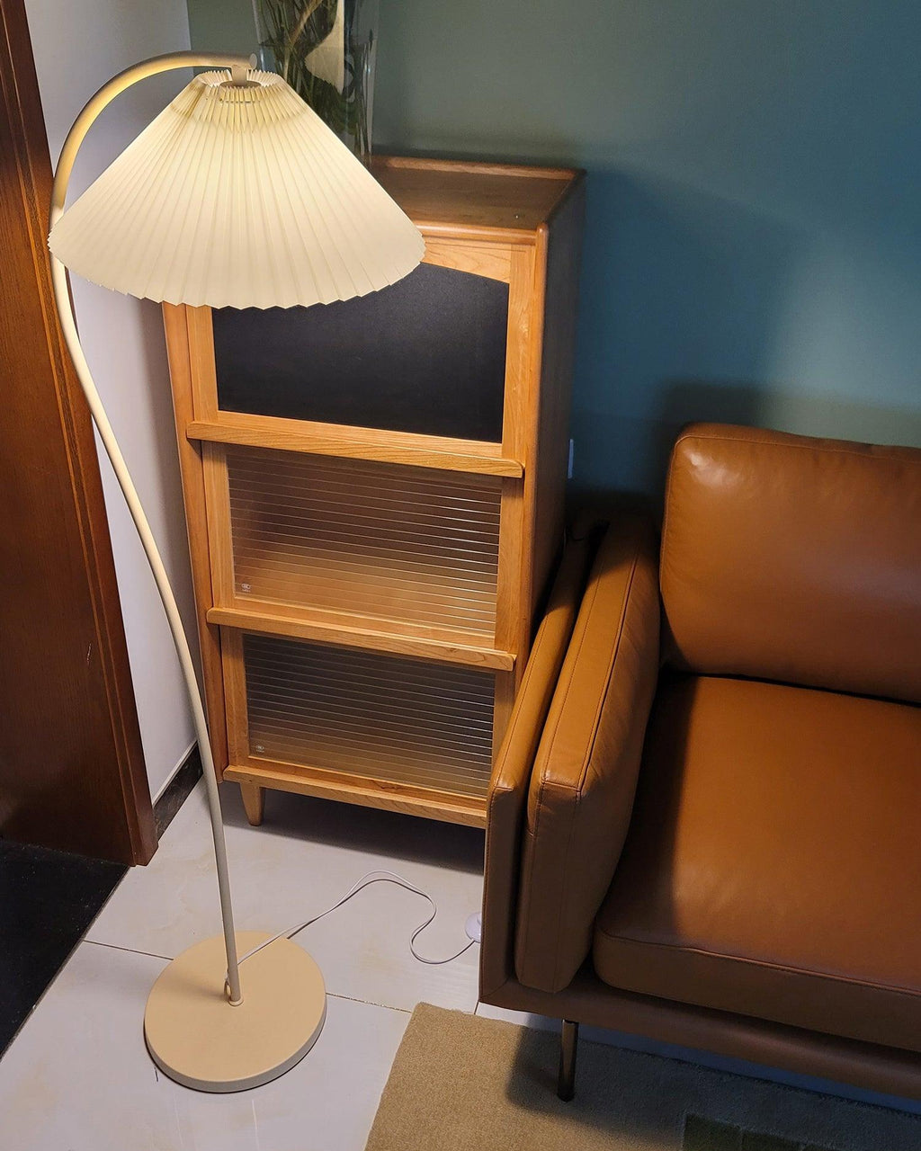 Detail of the beech wood and metal junction on the floor lamp