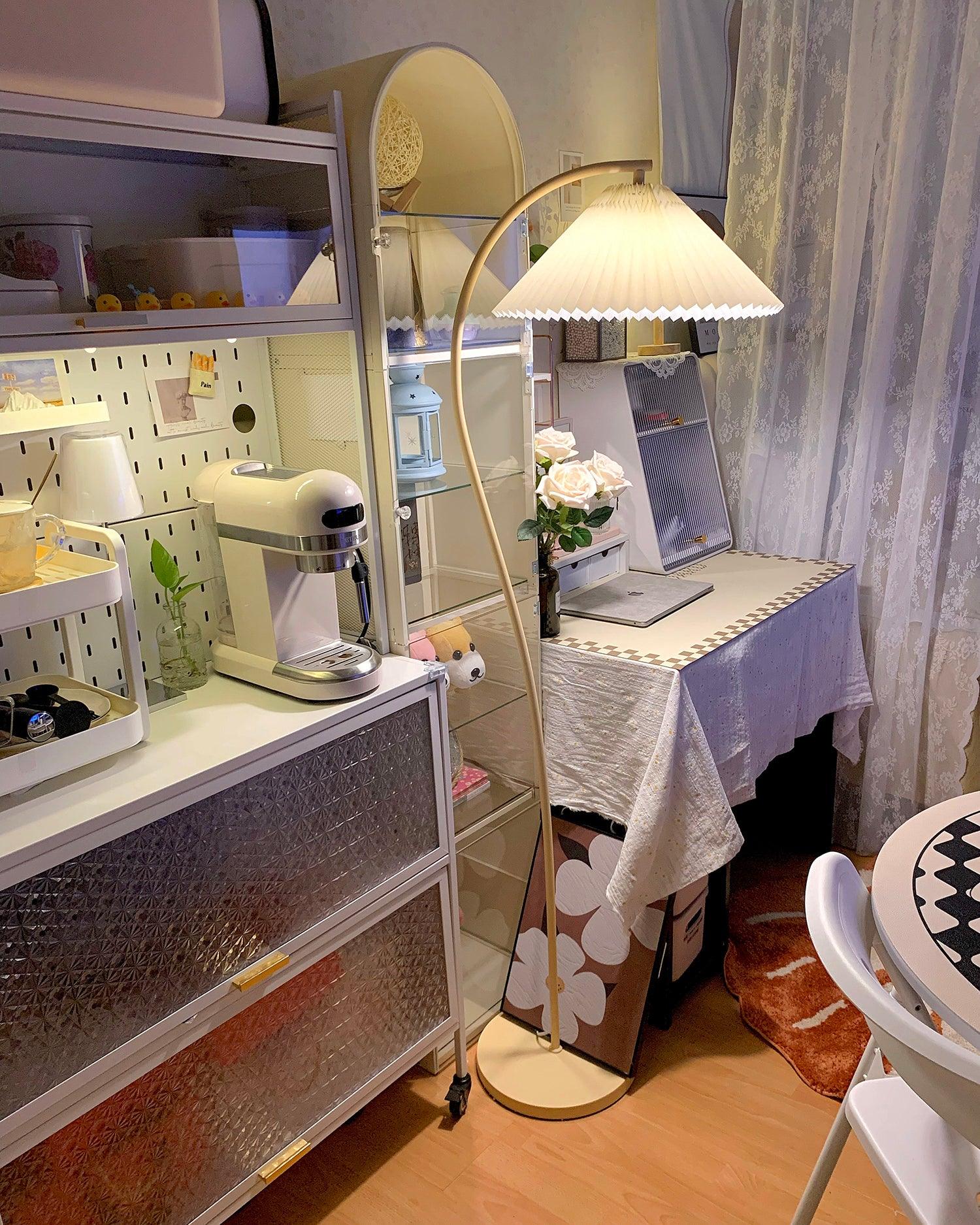 Pleated floor lamp shown against a soft neutral background
