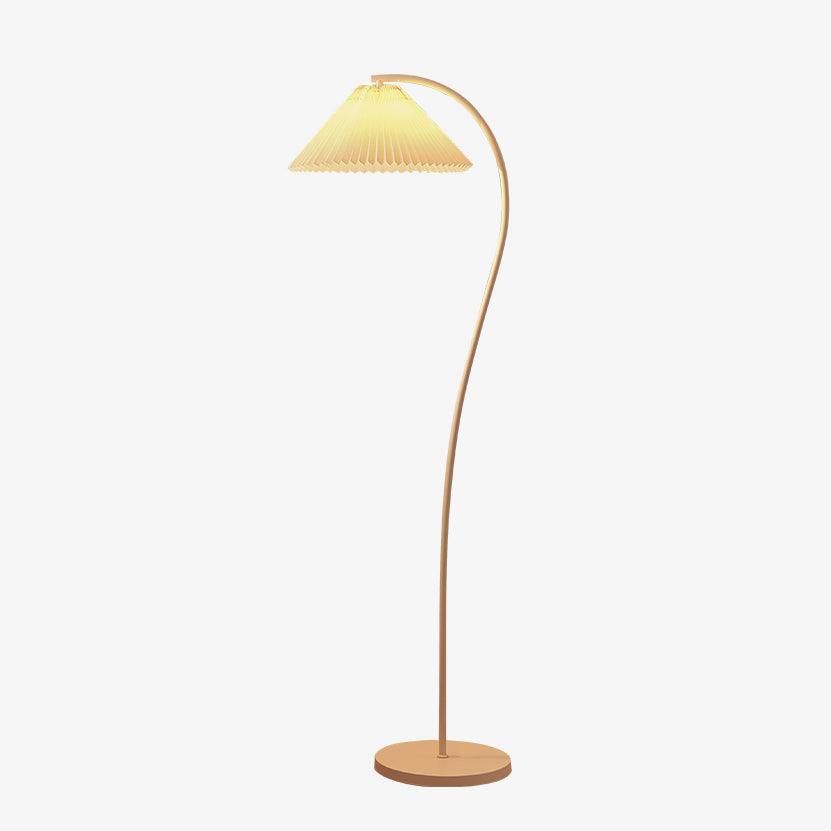 Pleated floor lamp standing beside a chair in a reading corner