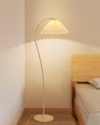 Pleated floor lamp shown full height in a studio setting