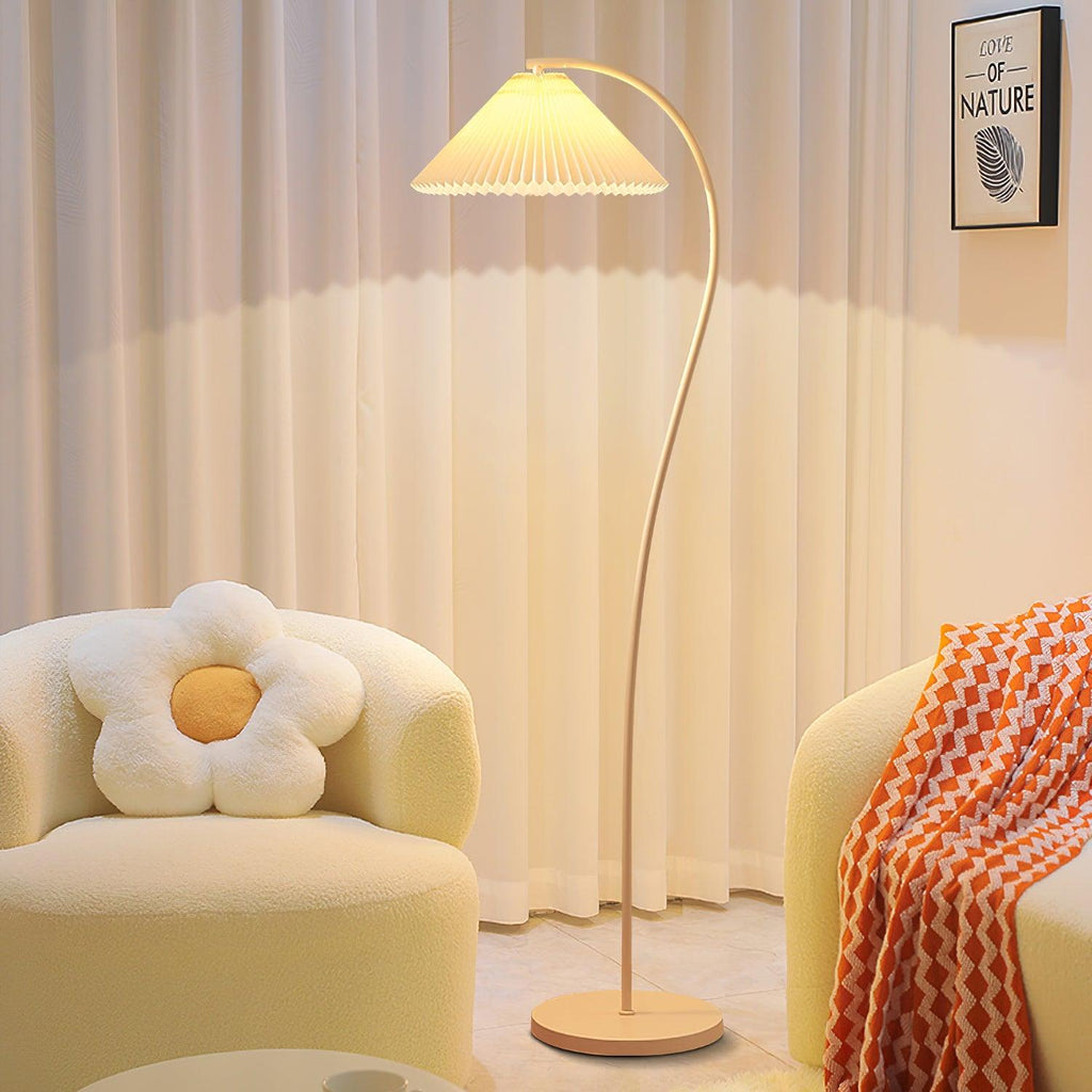 Pleated floor lamp glowing softly in a warm living room scene