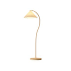 Pleated floor lamp shown in a bright, minimal interior