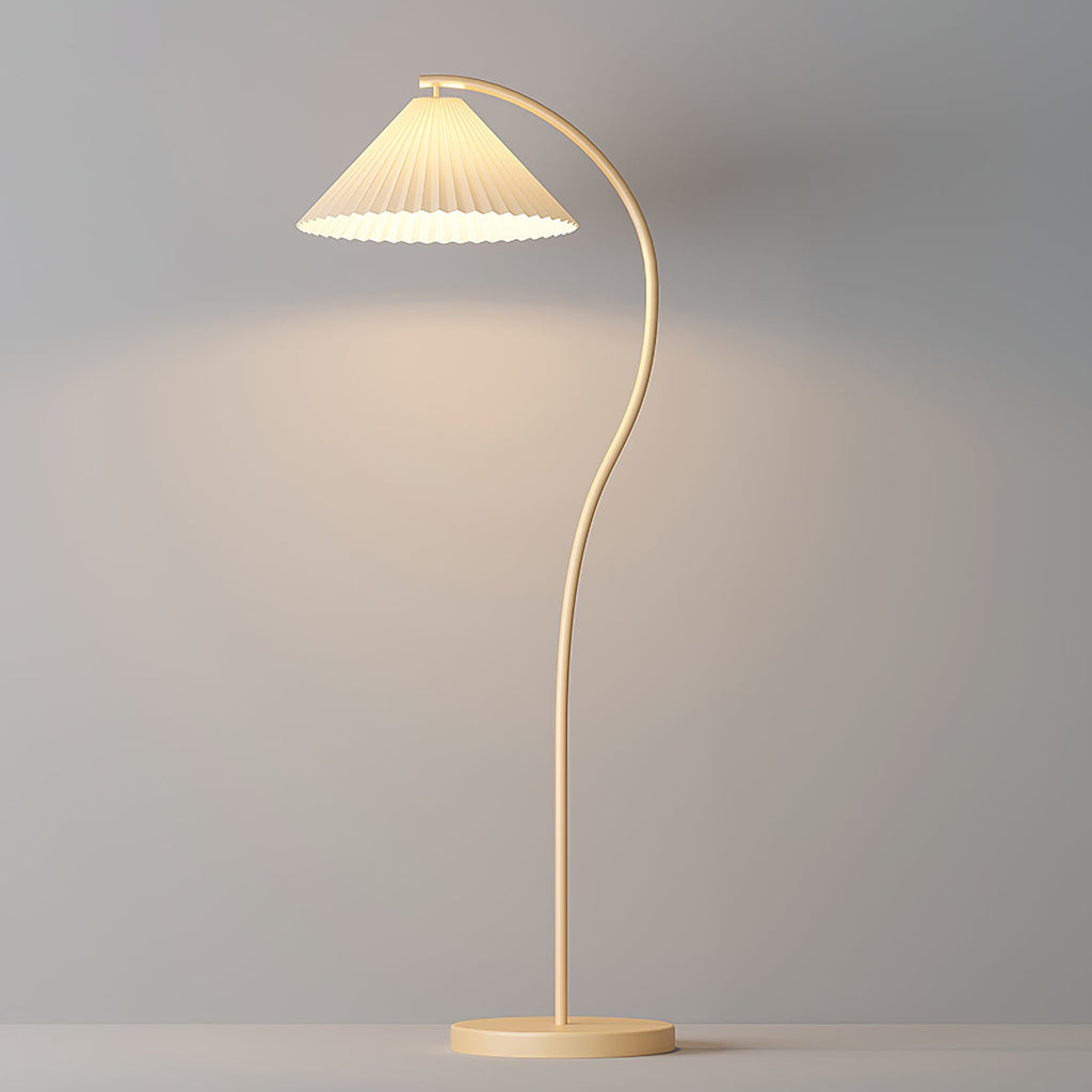 Pleated linen floor lamp beside a sofa in a warm setting