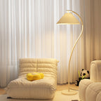 Pleated floor lamp shown full length against a neutral interior