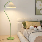 Pleated floor lamp adding vintage warmth to a corner