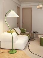 Pleated floor lamp lighting a reading nook softly