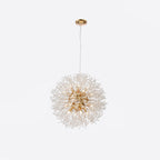 Product shot of a compact version of this Clérachic chandelier in a gold finish against a white backdrop.