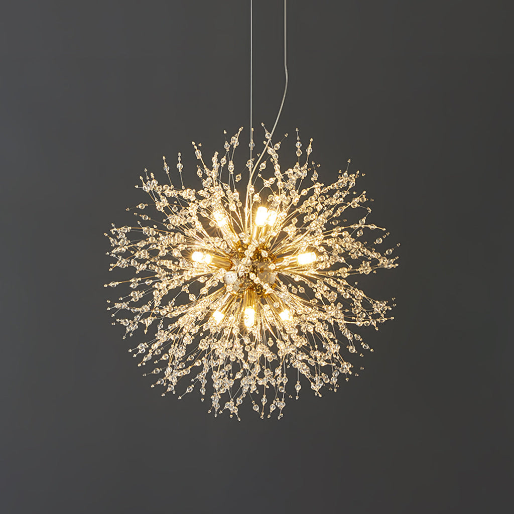 This Clérachic chandelier hangs lit against a dark charcoal wall, its crystal-tipped branches glowing warmly.