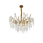 Round icicle chandelier on white, textured brass branches holding ribbed glass drops below a cast ceiling rose.