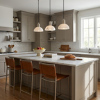 Hung in brushed nickel over a kitchen island, this Clérachic pendant lights rust-leather counter stools.