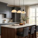 Above a dark island with charcoal stools, this black Clérachic pendant lights a grey-cabinet kitchen.