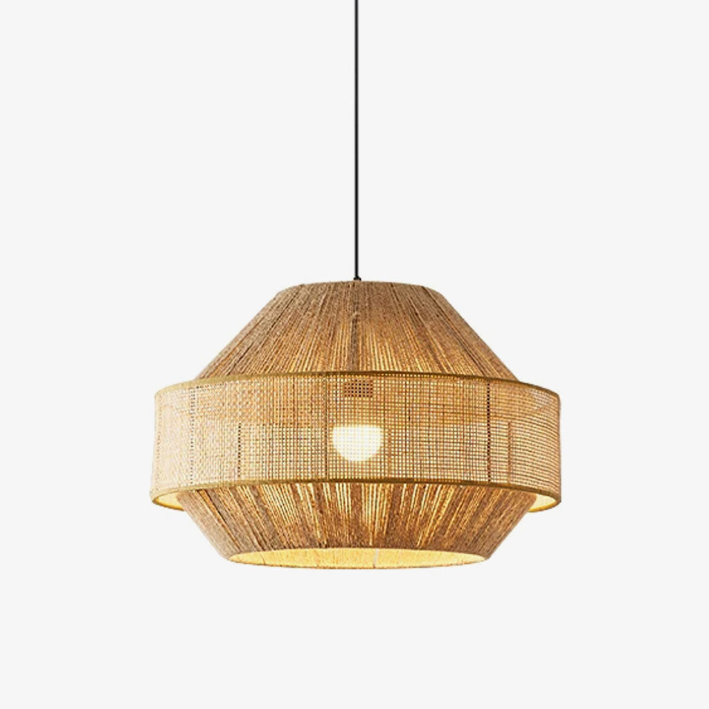 On a plain backdrop, this Clérachic pendant glows in natural rattan, its diagonal weave band catching the light.