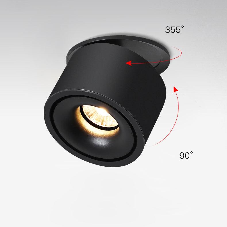 This Clérachic downlight in black is shown at an angle, illustrating how its lens head tilts within the housing.