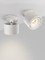 Two views of this Clérachic downlight in white, one showing its open mounting ring, the other angled and lit.