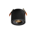 Product shot of this Clérachic downlight in black, angled, its spring-clip mounts extended against a plain white backdrop.