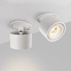 Two views of this Clérachic downlight in white: one with its mounting ring detached, one angled and lit, on a plain backdrop.