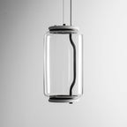 Close view of this Clérachic pendant's single glass cylinder, showing its black cord looping inside the glass.