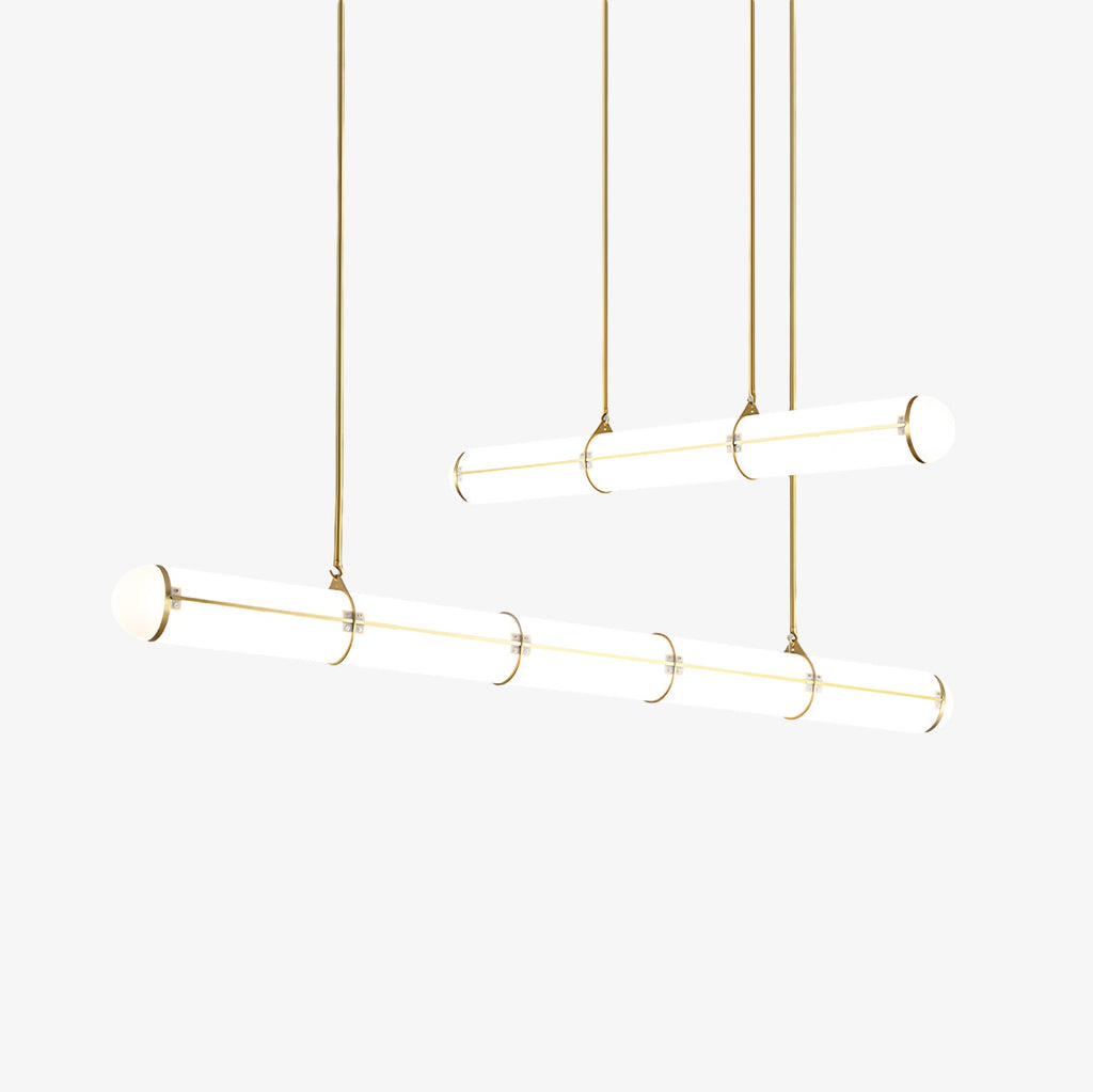 Linear pendant light suspended over a dining table