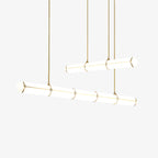 Linear pendant light suspended over a dining table