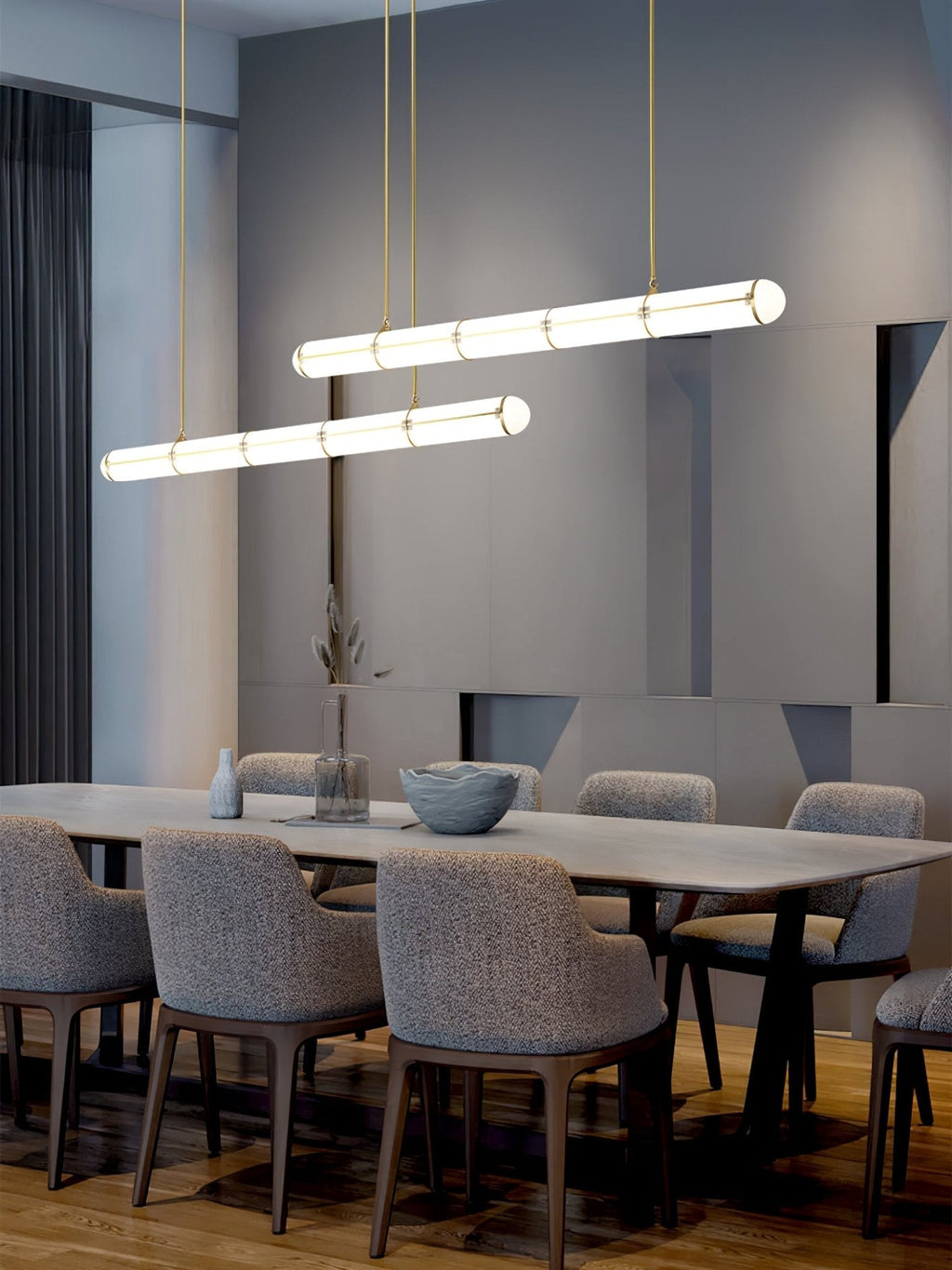 Linear pendant light in black finish over a dining setting