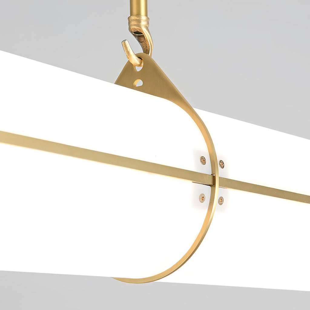 Linear pendant light suspended over a dining area