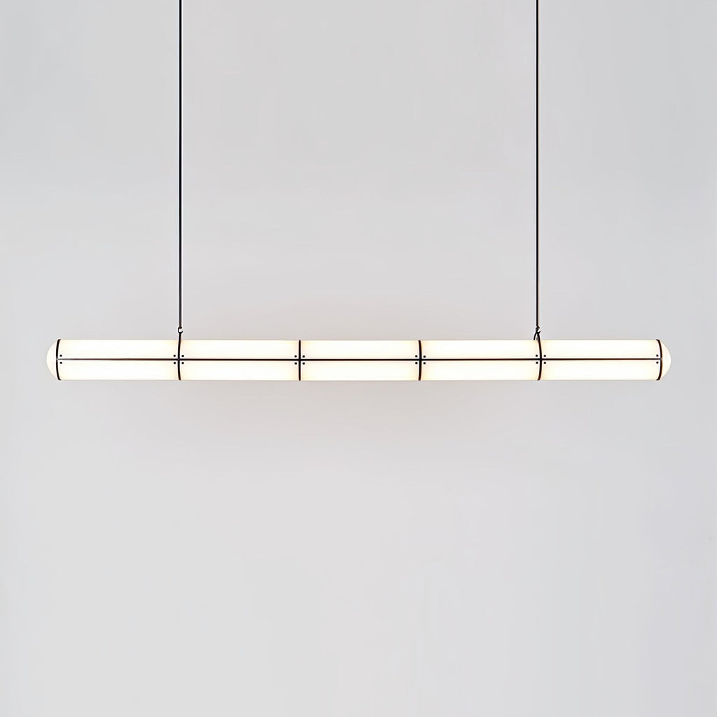 Linear pendant light shown in a minimal architectural room
