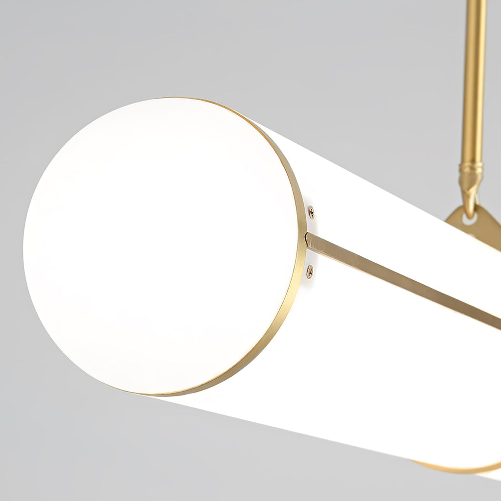 Linear pendant light shown lit in a warm interior