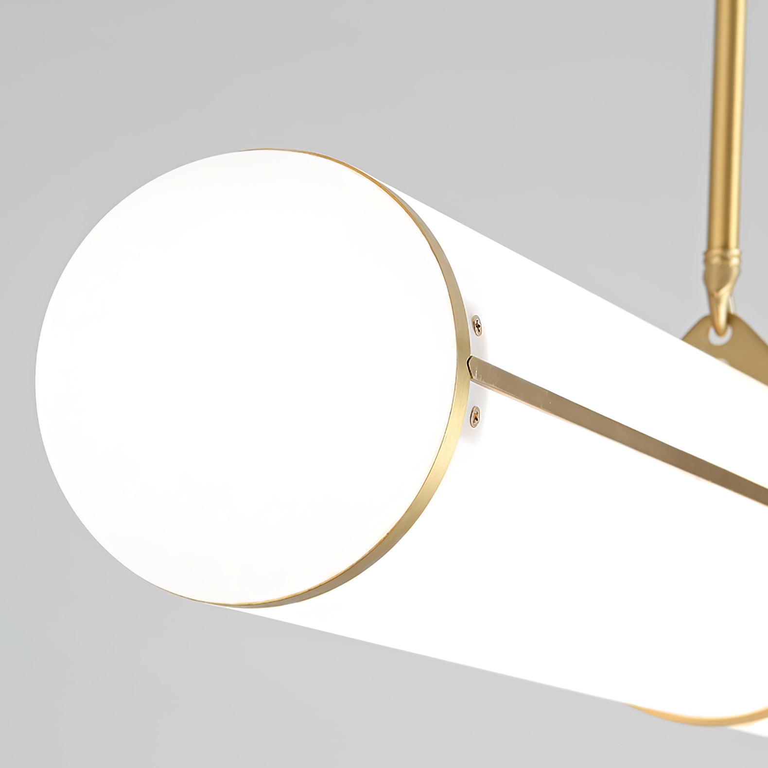Linear pendant light shown lit in a warm interior