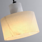 Alabaster pendant light shown lit and unlit to compare
