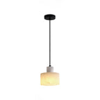 Alabaster pendant light with cable and ceiling canopy visible