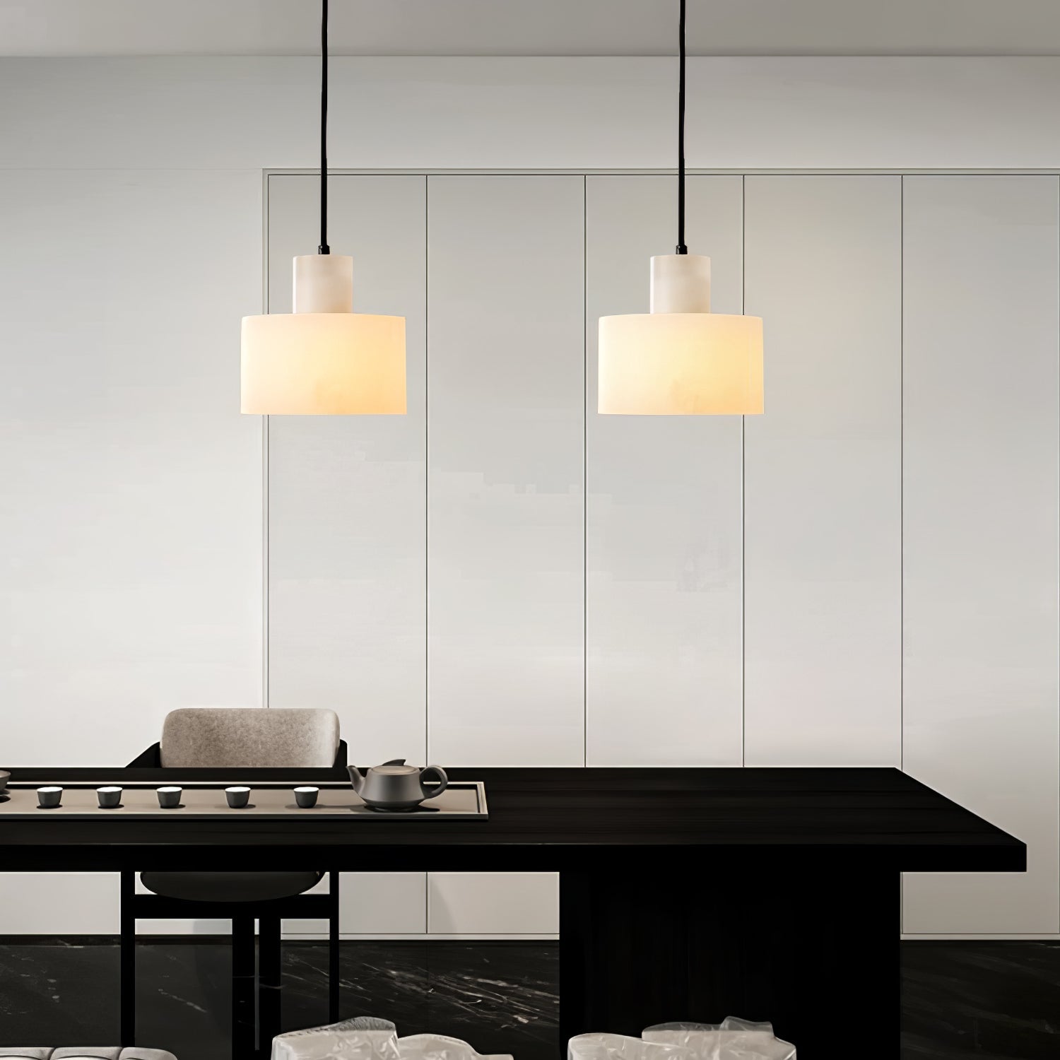 Warm stone glow from the alabaster pendant in a bedroom