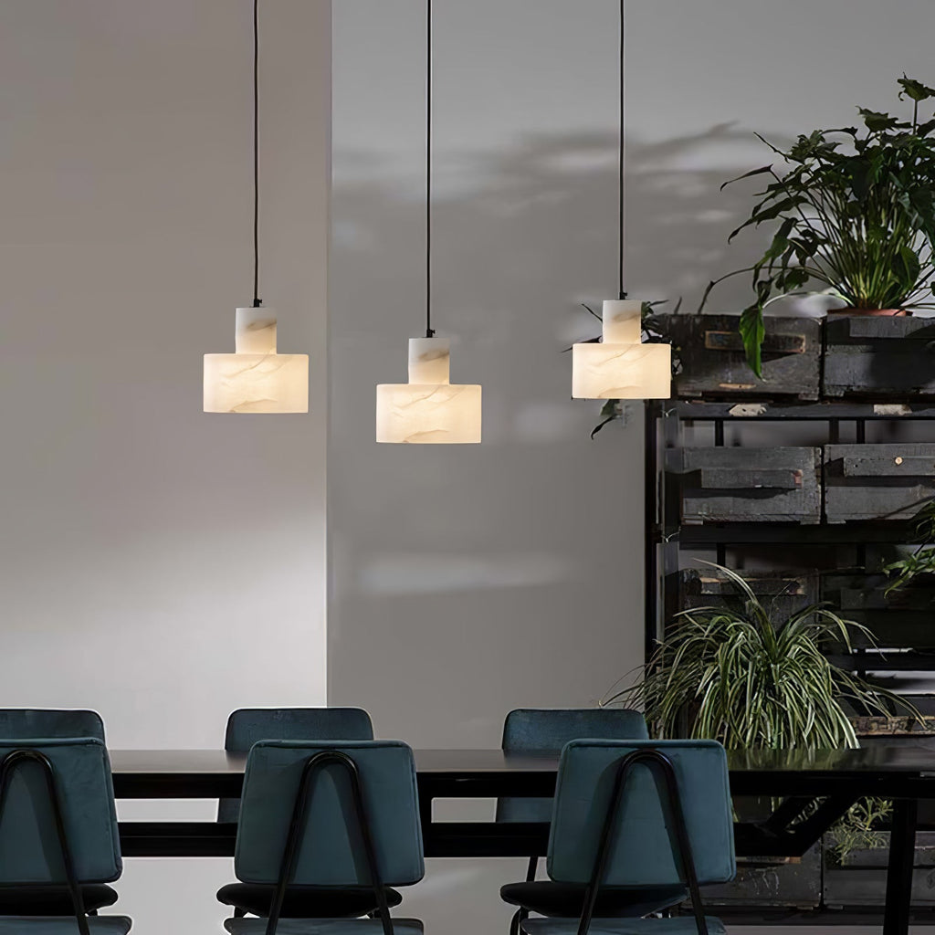 Alabaster pendant light glowing gently in a styled space