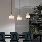Alabaster pendant light glowing gently in a styled space