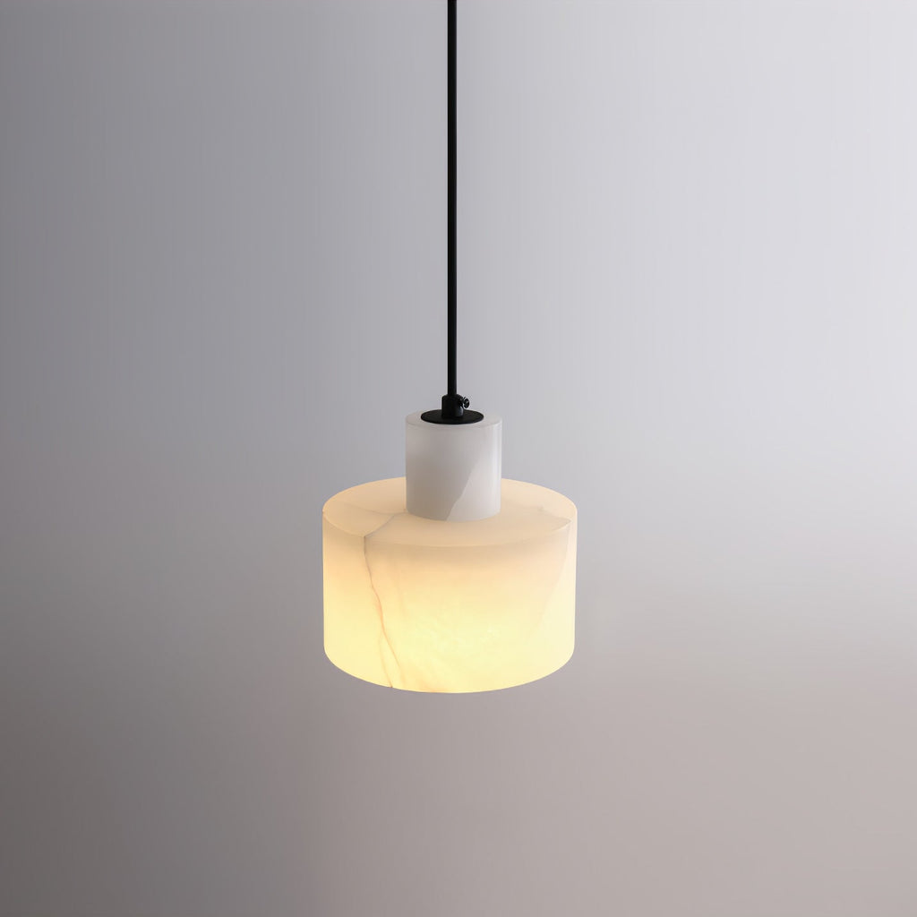 Cluster of alabaster pendant lights glowing in a lounge