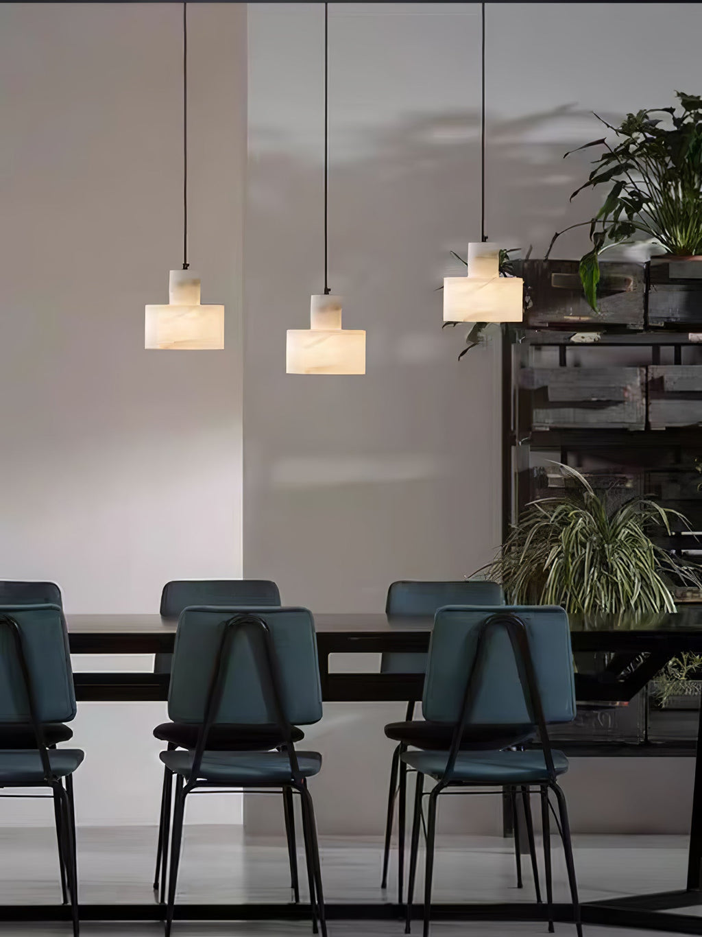 Alabaster pendant light hanging in a soft, warm interior