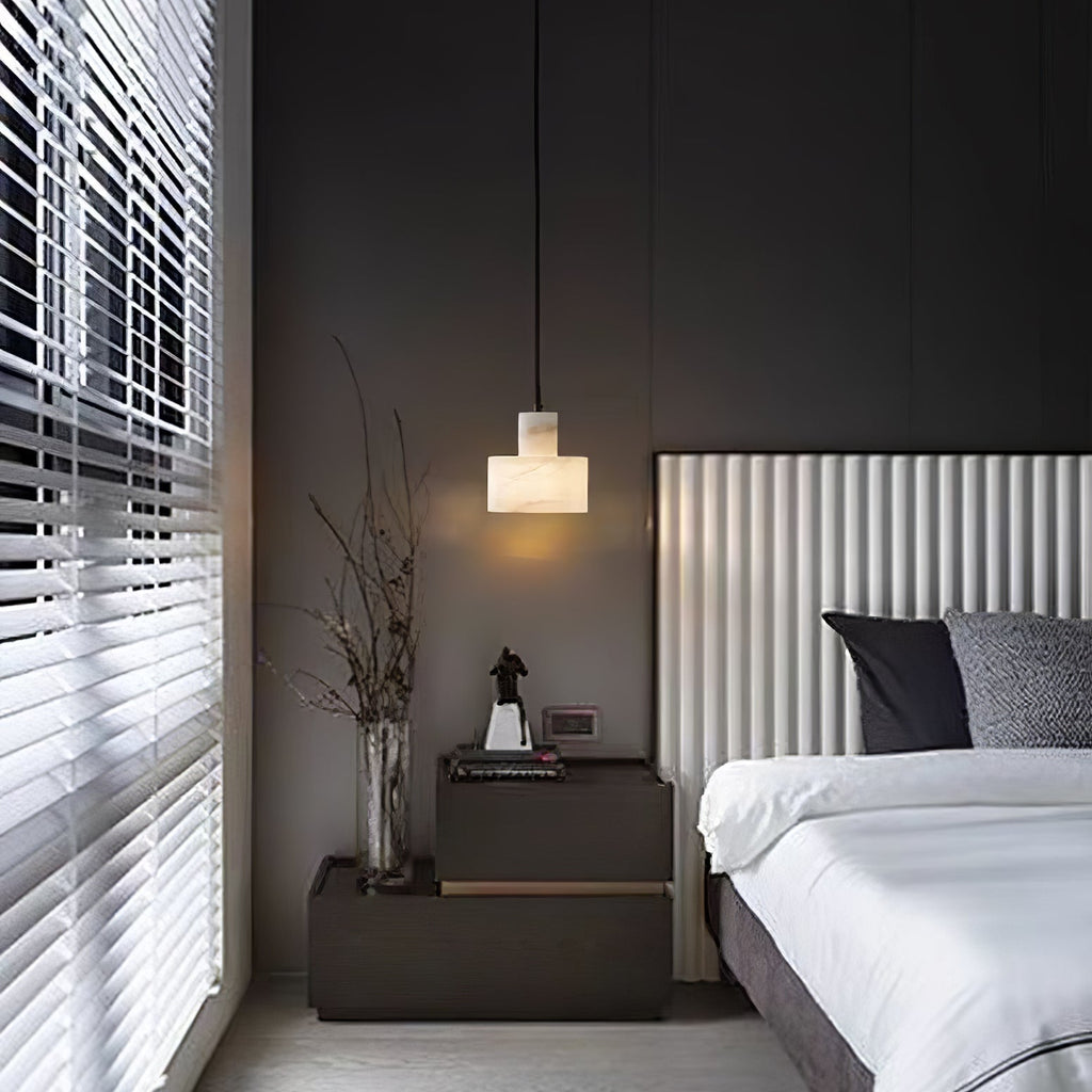 Alabaster pendant light shown unlit, polished stone finish visible